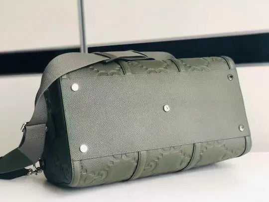 GG embossed leather travel bag
