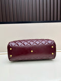Burgundy patent leather quilted Boston bag