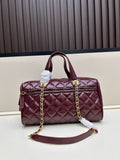 Burgundy patent leather quilted Boston bag