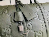 GG embossed leather travel bag